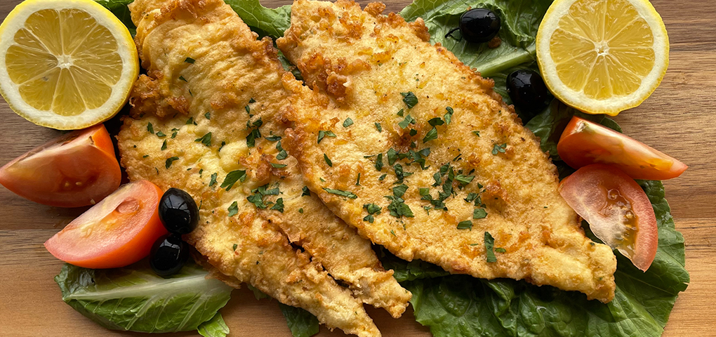 Double Cod fish, rice, and potatoes dinner dish.